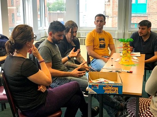 Teacher using gameboards in a classroom with their English students in Limerick.